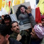 Mourners-carry-the-coffin-of-Saad-al-Baiji-the-Popular-Mobilisation-Forces-Anbar-operations-commander-who-was-killed-in-airstrikes-that-targeted-a-PMF-site-in-Iraqs-western-Anbar-provinc