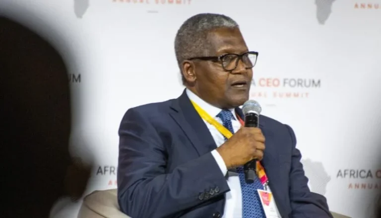 Dangote-Aliko-in-suit-holding-mic-alone